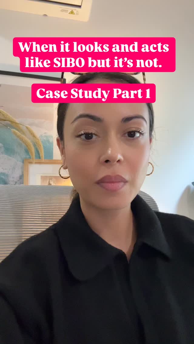 Kimberly Kushner in a black shirt in her home office, talking to camera